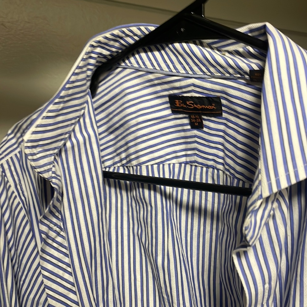 Striped down white and blue dress shirt.